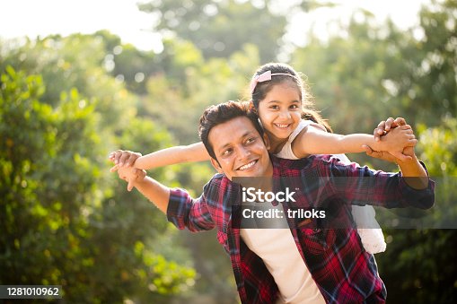 istock Father and daughter enjoying piggyback ride 1281010962