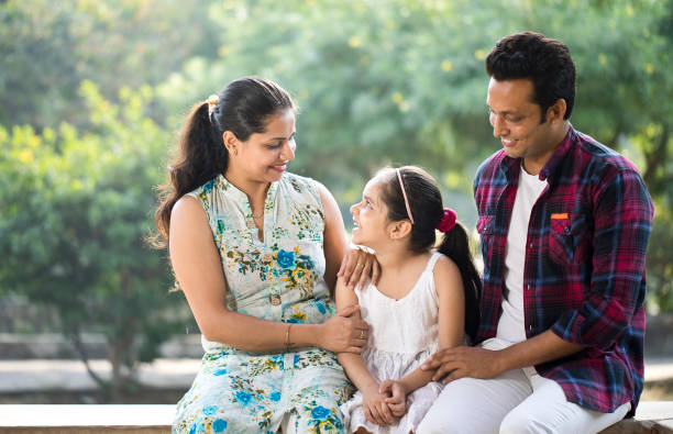 istock Happy family at park 1281011280
