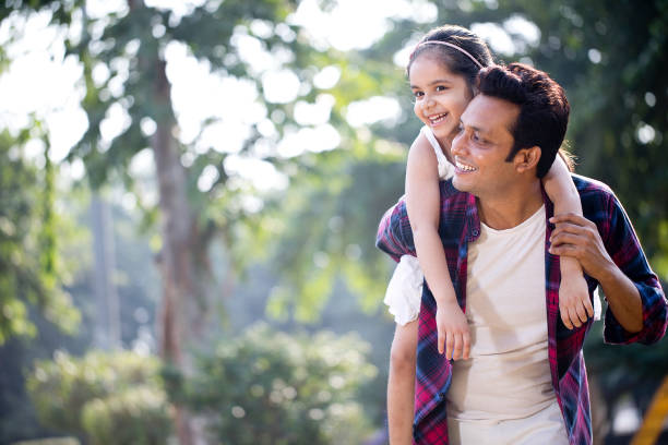 istock Father and daughter enjoying piggyback ride 1281011981