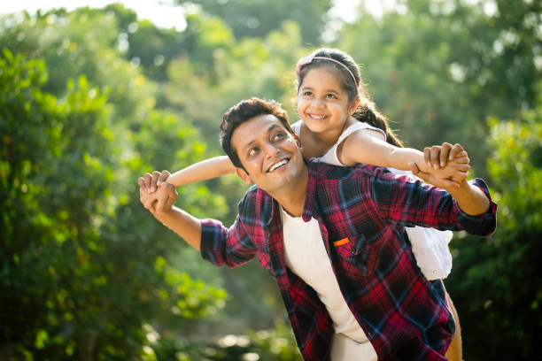 istock Father and daughter enjoying piggyback ride 1281012129