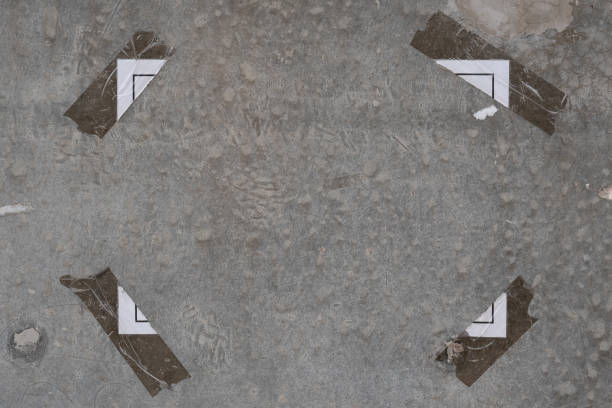 istock Adhesive tape with torn paper on concrete wall background 1281012406