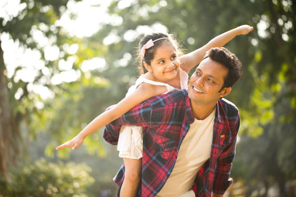 istock Father and daughter enjoying piggyback ride 1281013167