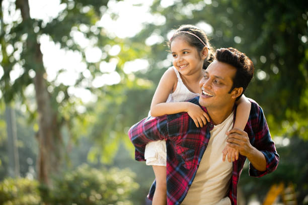istock Father and daughter enjoying piggyback ride 1281013342