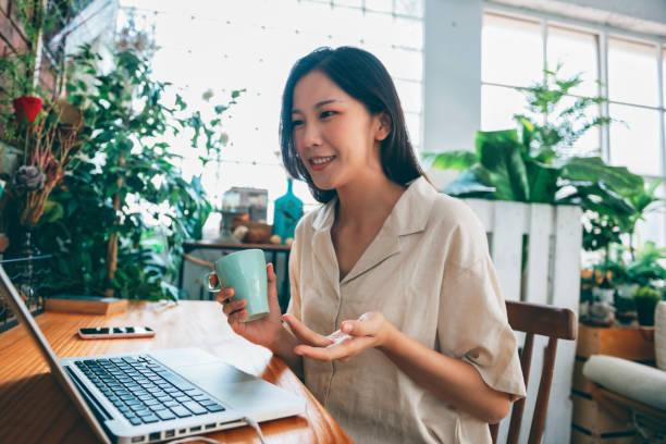 istock Asian woman working at home 1281014395