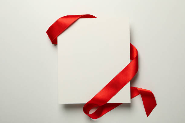 istock Red ribbon and space for text on white background 1281014539