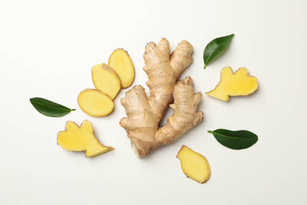 istock Fresh raw ginger and leaves on white background 1281014827