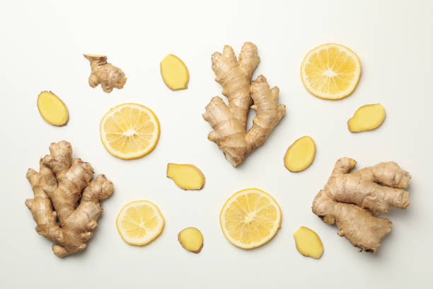 istock Fresh ginger and lemon on white background, top view 1281014943