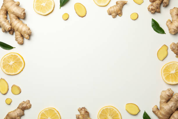 istock Fresh ginger and lemon on white background, top view 1281015724