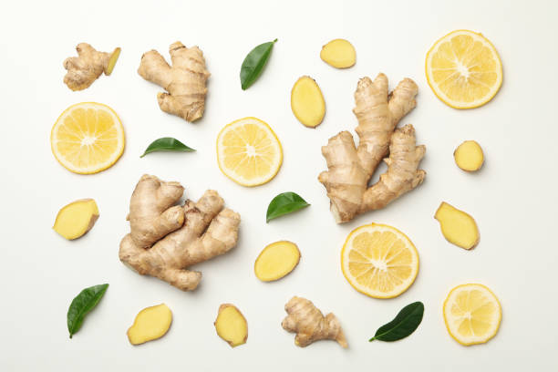 istock Fresh ginger and lemon on white background, top view 1281015850