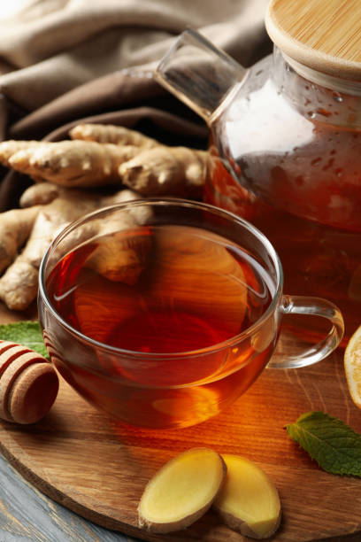 istock Concept of breakfast with ginger tea on wooden background 1281015987