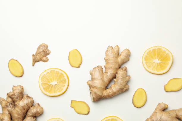 istock Fresh ginger and lemon on white background, top view 1281016147
