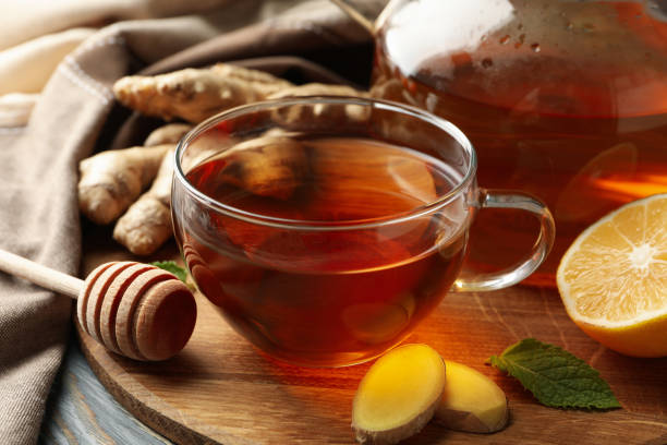 istock Concept of breakfast with ginger tea on wooden background 1281016383