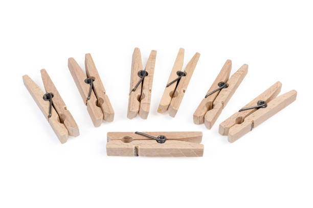 istock New wooden clothespins on a white background 1281017978