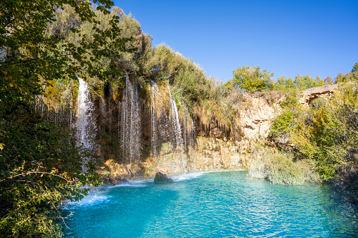Cascada del Molino de San Pedro waterfall in the Cabriel river at Sierra De Albarracion of Teruel Aragon of spain