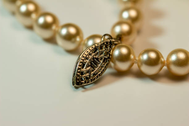 istock Macro texture view of creamy white color woolen mittens adorned with pearls 1281020657