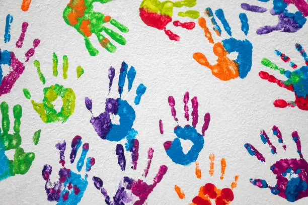 Photo of multicolor people handprints