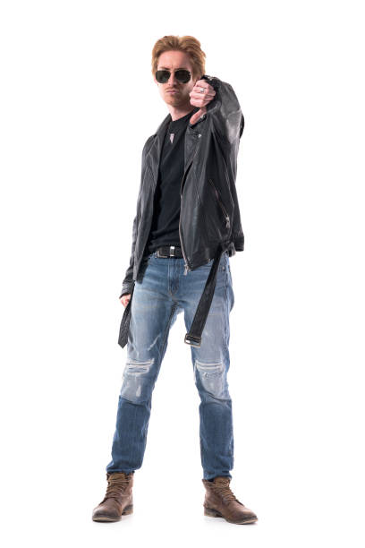 istock Dominant macho displeased young biker style man showing thumb down gesture. 1281021097