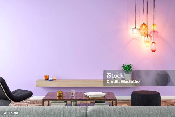 Empty Nostalgic Living Room With Gray Sofa Lounge Chair Pouffe Table And Decoration In Front Of Lavender Plaster Wall Background Stock Photo - Download Image Now