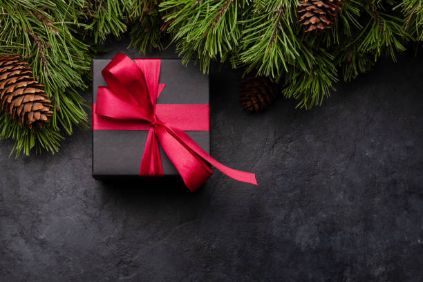 istock Christmas greeting card with fir tree and gift box 1281022687