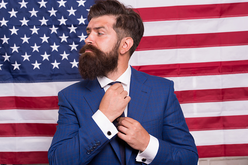 American citizen. Happy celebration of victory. Bearded hipster man being patriotic for usa. TV host. National holidays. Proud of motherland. American reform. July 4. American citizen usa flag.