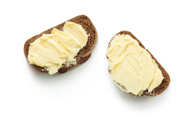 istock two pieces of bread with butter isolated white background 1281023293