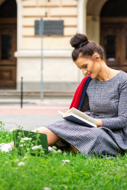 istock Student woman reading the book 1281025083