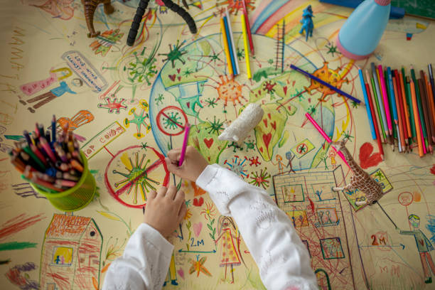 istock Little girl drawing during coronavirus pandemic 1281026231