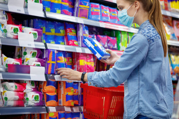 istock Woman choosing between sanitary napkins during covid-19 outbreak 1281026280