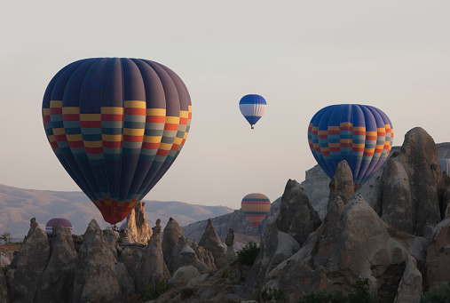 Colorful hot air balloons flying in the morning over Cappadocia
