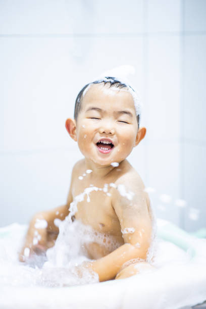 istock Baby Boys playing water when bathing 1281033926