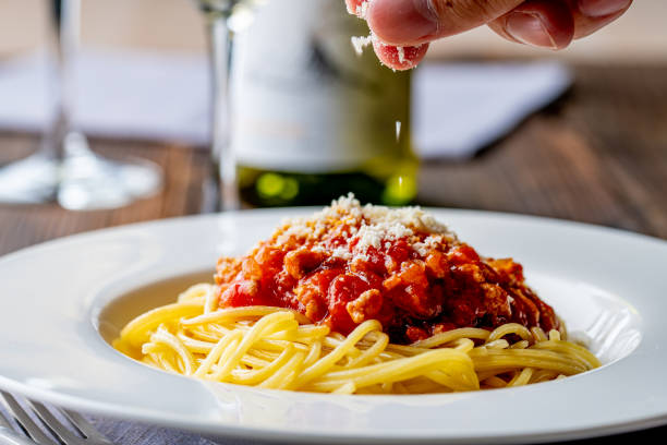 istock Pasta with meat and tomato sauce on wooden table. 1281036084
