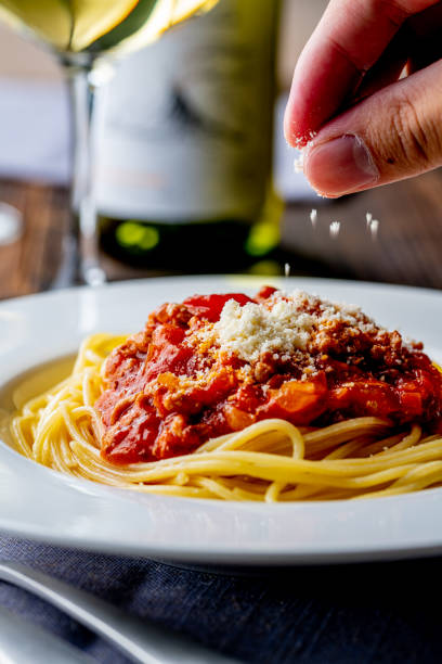 istock Pasta with meat and tomato sauce on wooden table. 1281036245