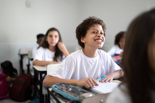 istock Schoolboy studying in the classroom at school 1281039655