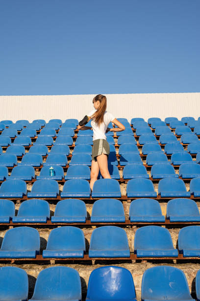 istock Girl doing sports alone in an empty track. 1281039848