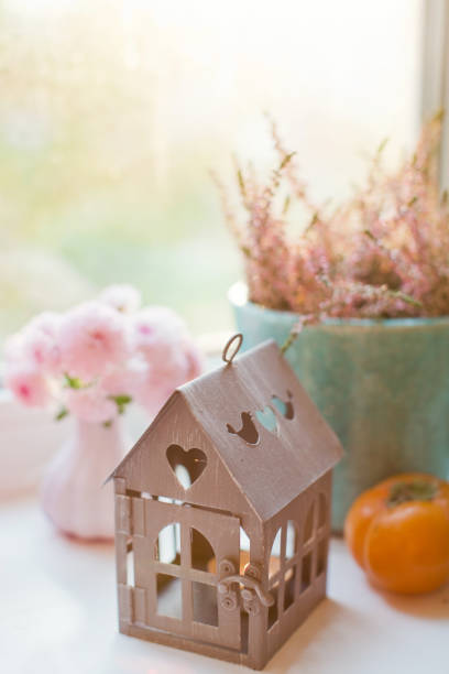 istock House lantern candle and flowers 1281042500