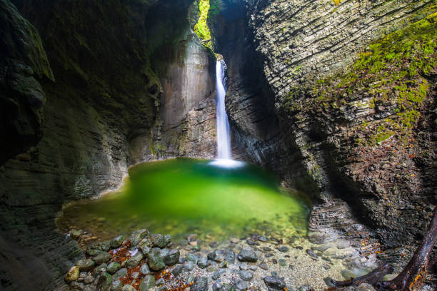 waterfall Kozjak falling in cave stock photo