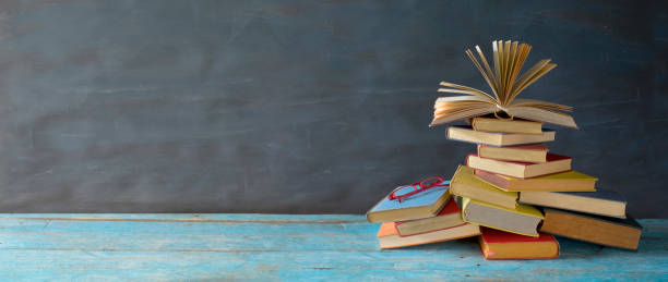 open book on a stack of books, reading, education, education concept, panoramic,large free copy space