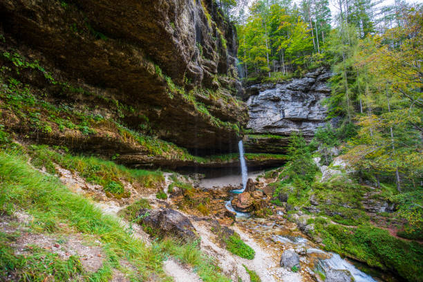 mystic waterfall pericnik with sourrounding rocks stock photo