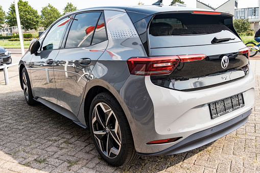 Kampen, The Netherlands - September 11, 2020: Volkswagen ID.3 all electric compact car in grey rear view parked outside a dealership. The ID.3 is the first model of the I.D. Series and was presented in September 2019 with the first cars hitting the road in September 2020 after multiple delays. The VW ID.3 is available as Pure, Pro and Pro S with a range of 330 to 550 km.