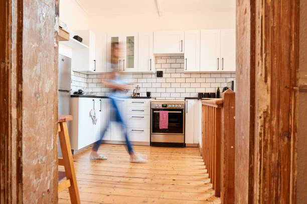 istock Woman in blurred motion working in her kitchen 1281048306
