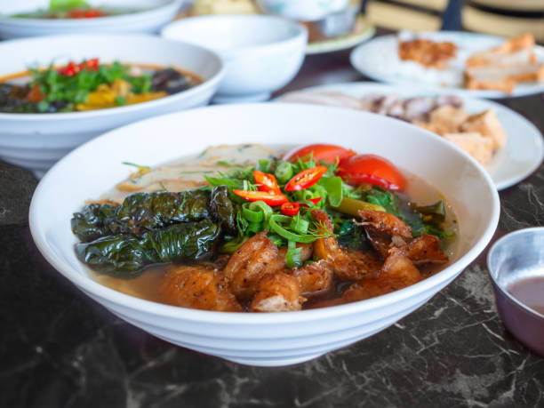istock Delicious Vermicelli Noodle Soup With Fish Cake and Tomatoes 1281049158