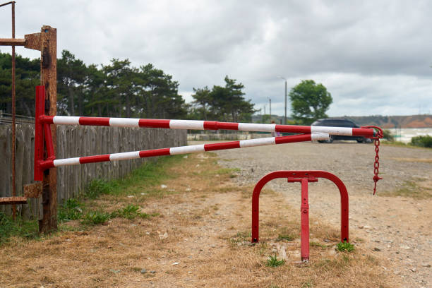 istock The dirt road is blocked by a metal barrier, stop gate 1281049596