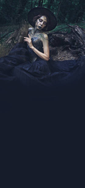 istock Halloween vertical banner with witch in a dark magic forest. 1281051123