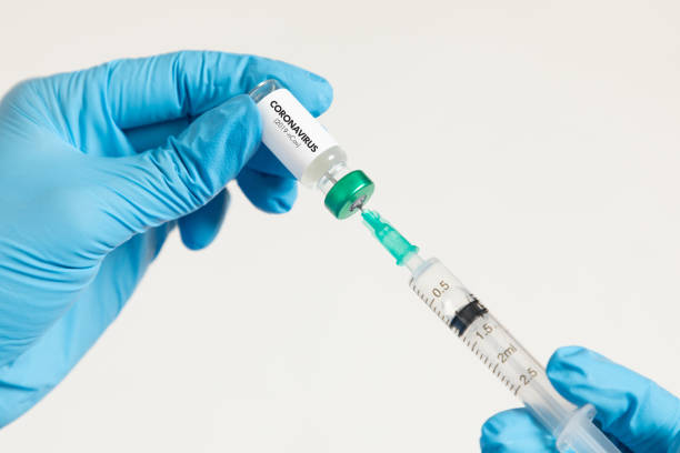 istock Doctor holding coronavirus vaccine 1281051865