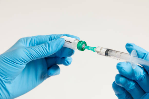 istock Doctor holding coronavirus vaccine 1281051920