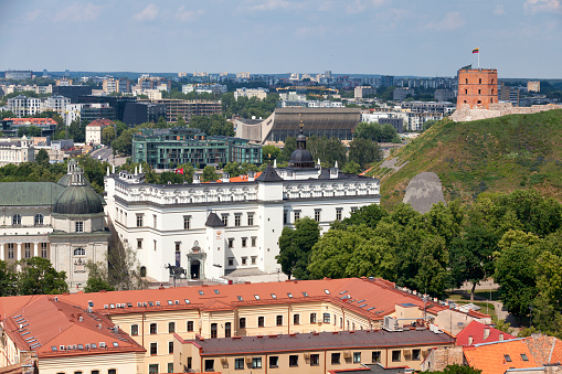 Vilnius, Lithuania - June 11 2019: Aerial view of the Gediminas' Tower overlooking the Palace of the Grand Dukes of Lithuania, the Cathedral Basilica of St Stanislaus and St Ladislaus as well as the Vilnius Palace of Concerts and Sports.