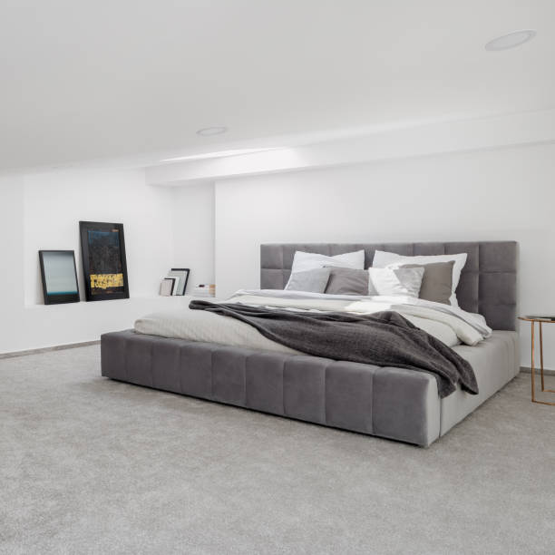 istock White and gray bedroom with big bed 1281054556