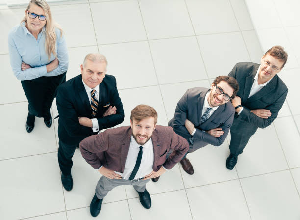 istock top view. group of successful business people looking at the camera 1281055268