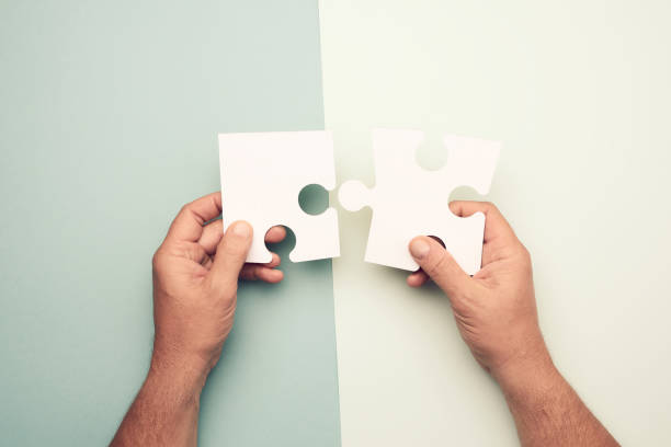 istock male hand holding big paper white blank puzzles 1281059119