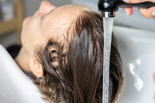 istock hair washing process in a beauty salon 1281060959